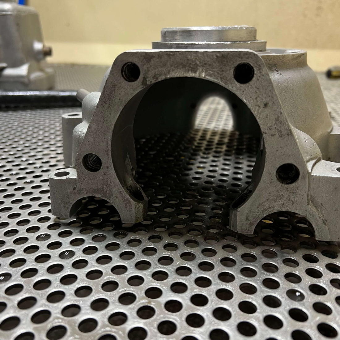 How Does Vapour Blasting Work? close-up of a metal component ready for aqua blasting in Lincolnshire.