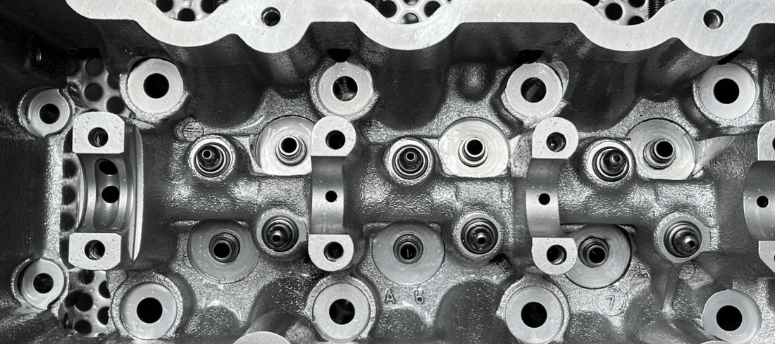 Vapour Blasting process removing contaminants from engine cylinder head for parts restoration.